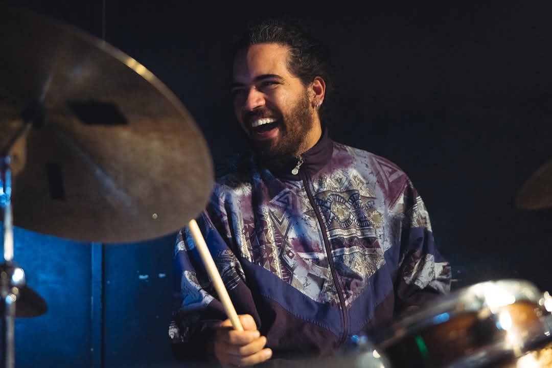 Matheus Jardim playing drums